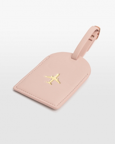 Lyserød bagagemærke i vegansk læder