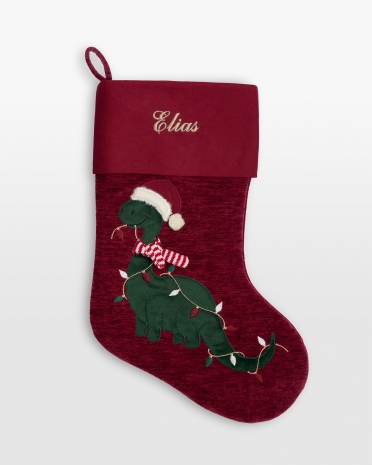 Julestrømpe med broderet navn og motiv af en juleagtig dinosaur