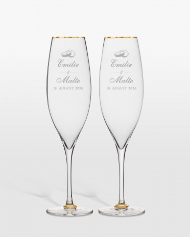 Champagneglas med guldringe på stilken og personlig gravering til brudeparret