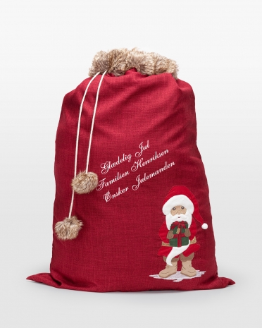 Rød julegavesæk med personlig hilsen, perfekt til unikke julegaver og festlig opbevaring.