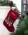 Rød julestrømpe med togmotiv og broderet navn