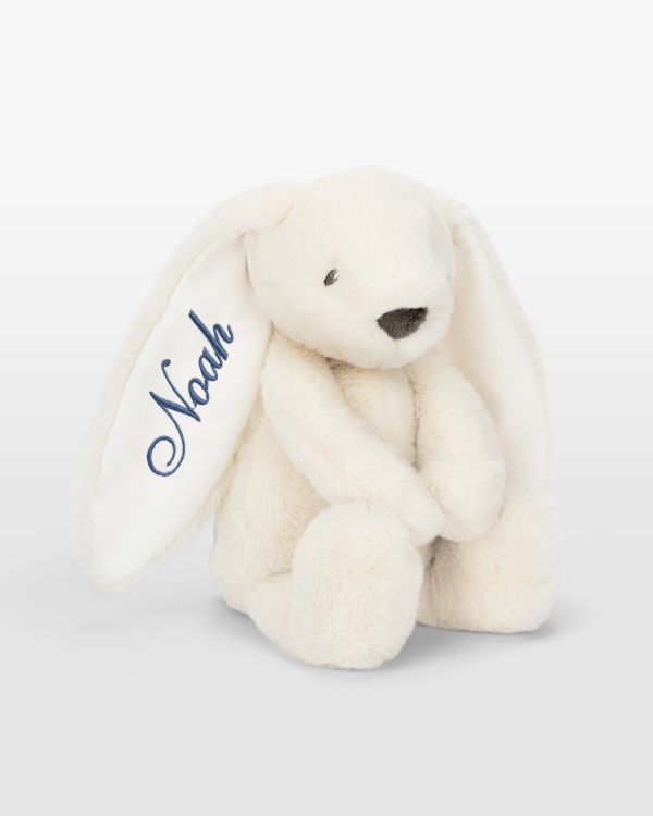 Cremefarvet kanin med blå brodering