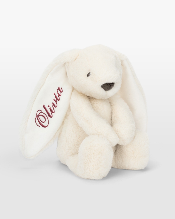 Cremefarvet kanin med mørkerosa brodering