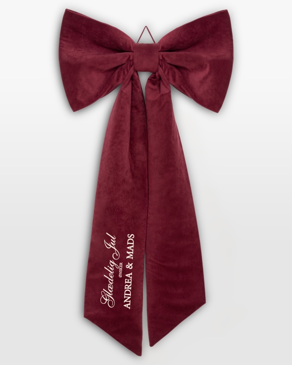 Stor rød sløjfe i fløjl med personlig julehilsen