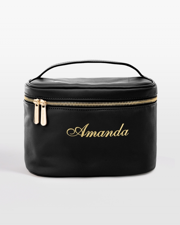 Sort makeuppung med broderet navn i guld
