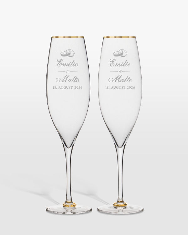Champagneglas med guldringe på stilken og personlig gravering til brudeparret