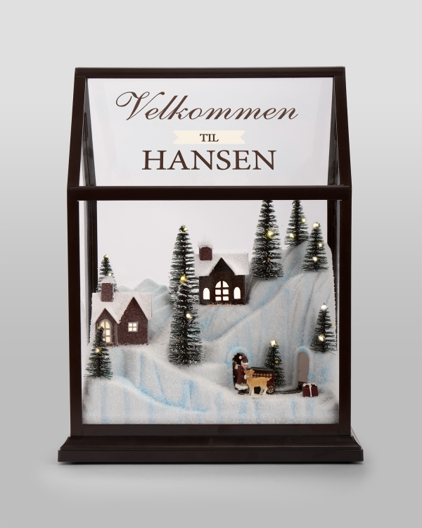 Personlig juleby med blinkende lys og julehilsen